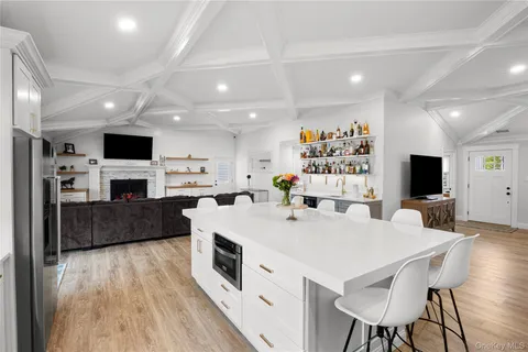 a view of kitchen with cabinets and wooden floor