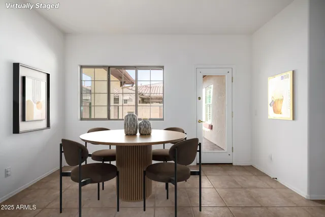 a dining room with furniture and window