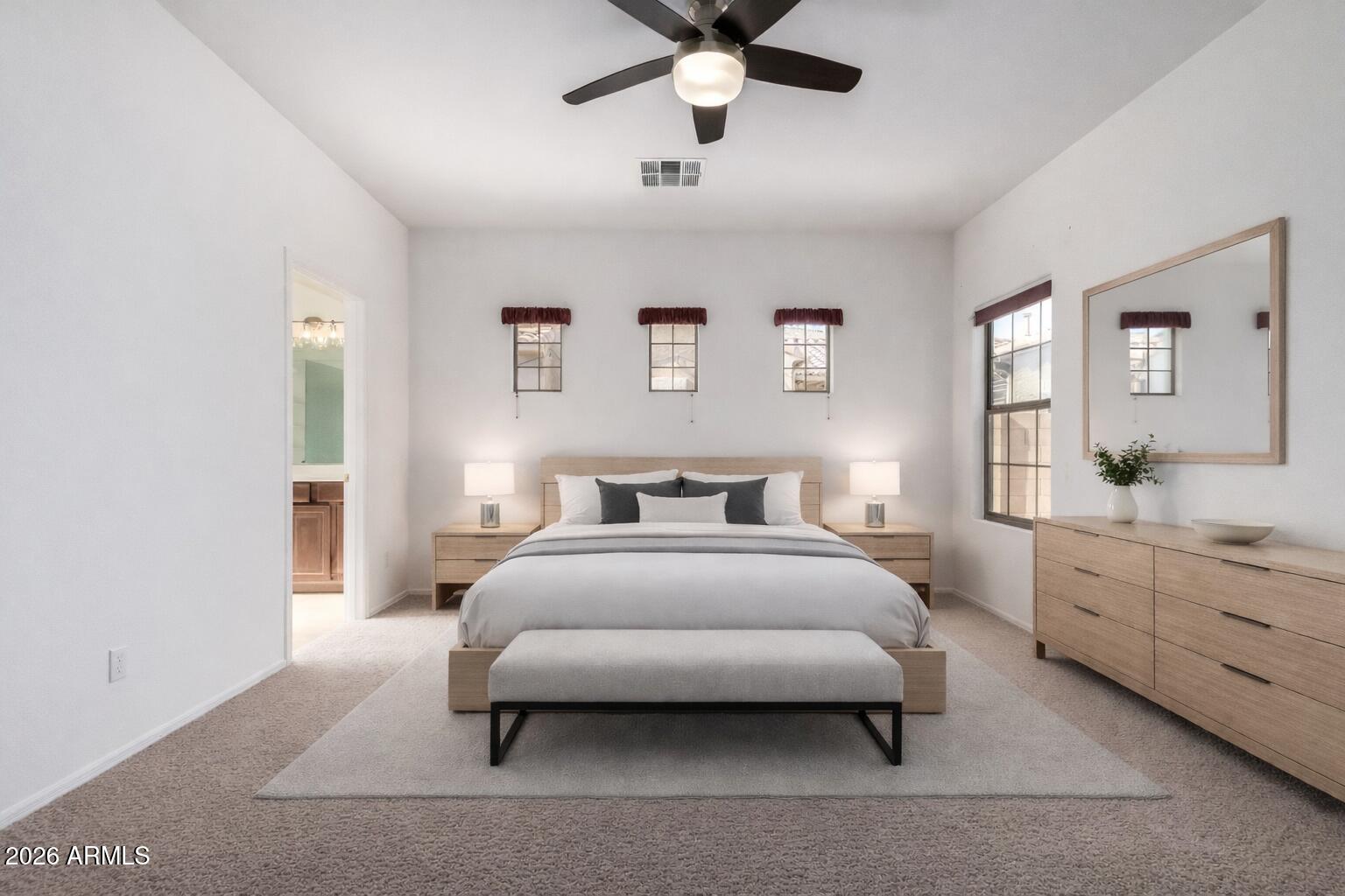 2602 South Nielson Street Gilbert, AZ 85295 - Photo 16 of 39 a bedroom with a bed and a chandelier