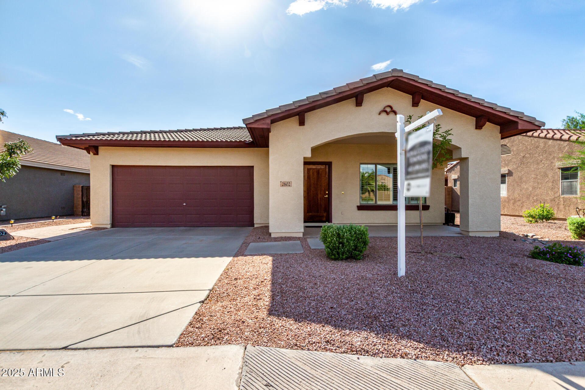 2602 South Nielson Street Gilbert, AZ 85295 - Photo 2 of 39 a front view of a house with garden