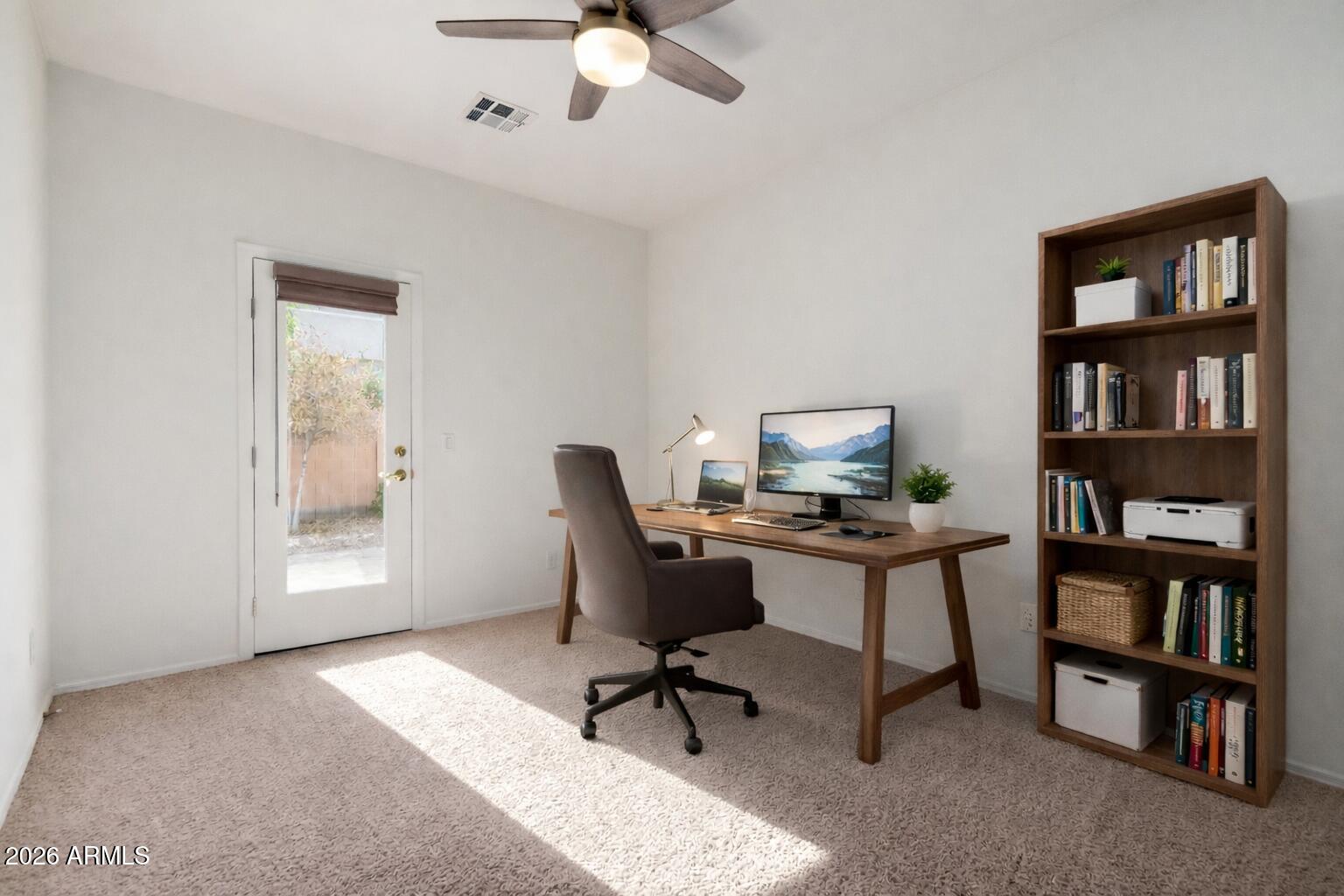 2602 South Nielson Street Gilbert, AZ 85295 - Photo 23 of 39 a workspace with a bookshelf