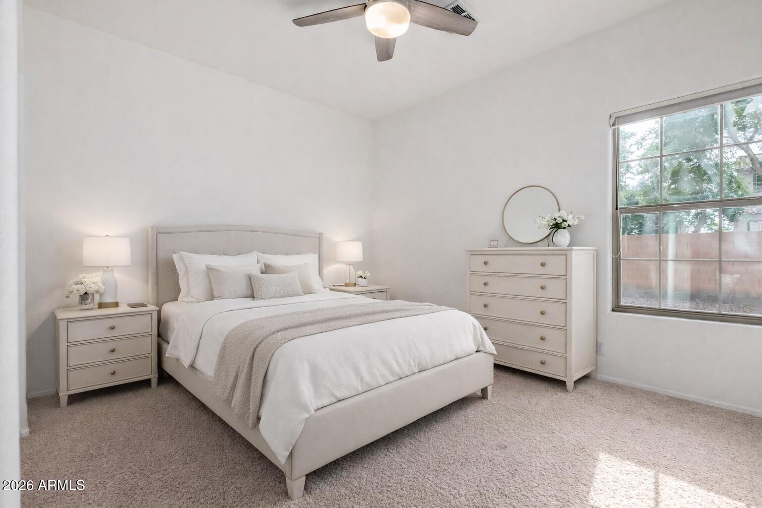 2602 South Nielson Street Gilbert, AZ 85295 - Photo 24 of 39 a bedroom with a bed and a chandelier