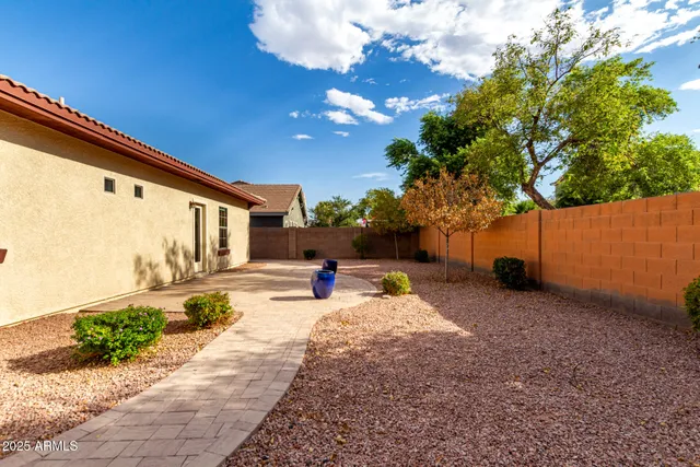 a view of a backyard with sitting area
