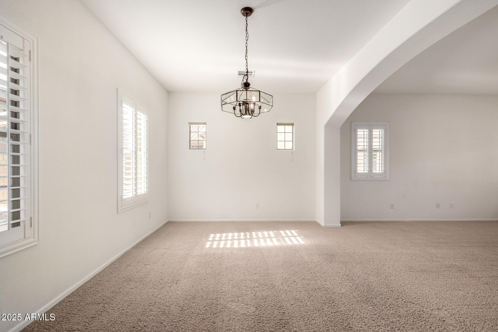 2602 South Nielson Street Gilbert, AZ 85295 - Photo 9 of 39 a view of a windows and chandelier in a room