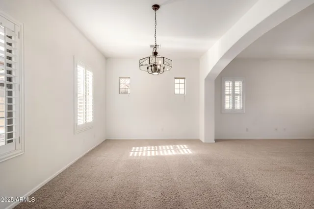 a view of a windows and chandelier in a room