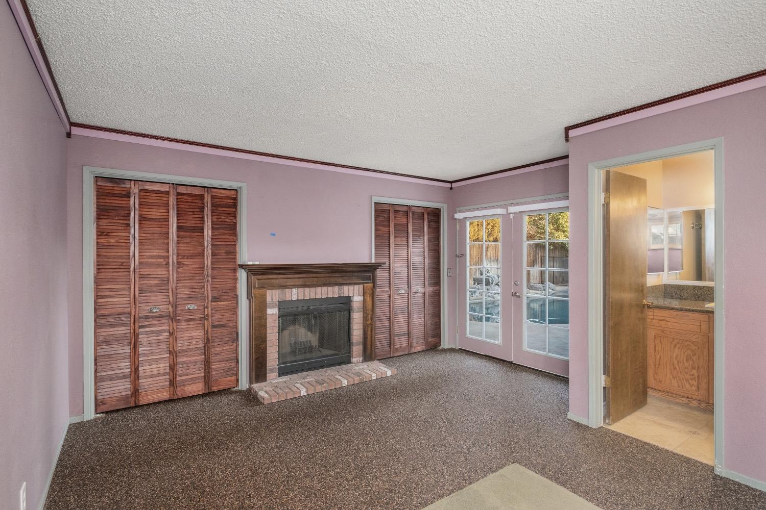 915 Fordham Avenue Clovis, CA 93611 - Photo 15 of 23 a view of a livingroom with an empty space and a fireplace