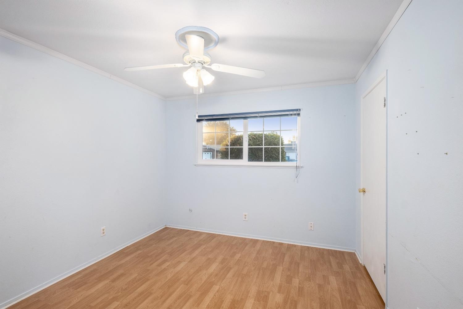 915 Fordham Avenue Clovis, CA 93611 - Photo 19 of 23 wooden floor in an empty room with a window
