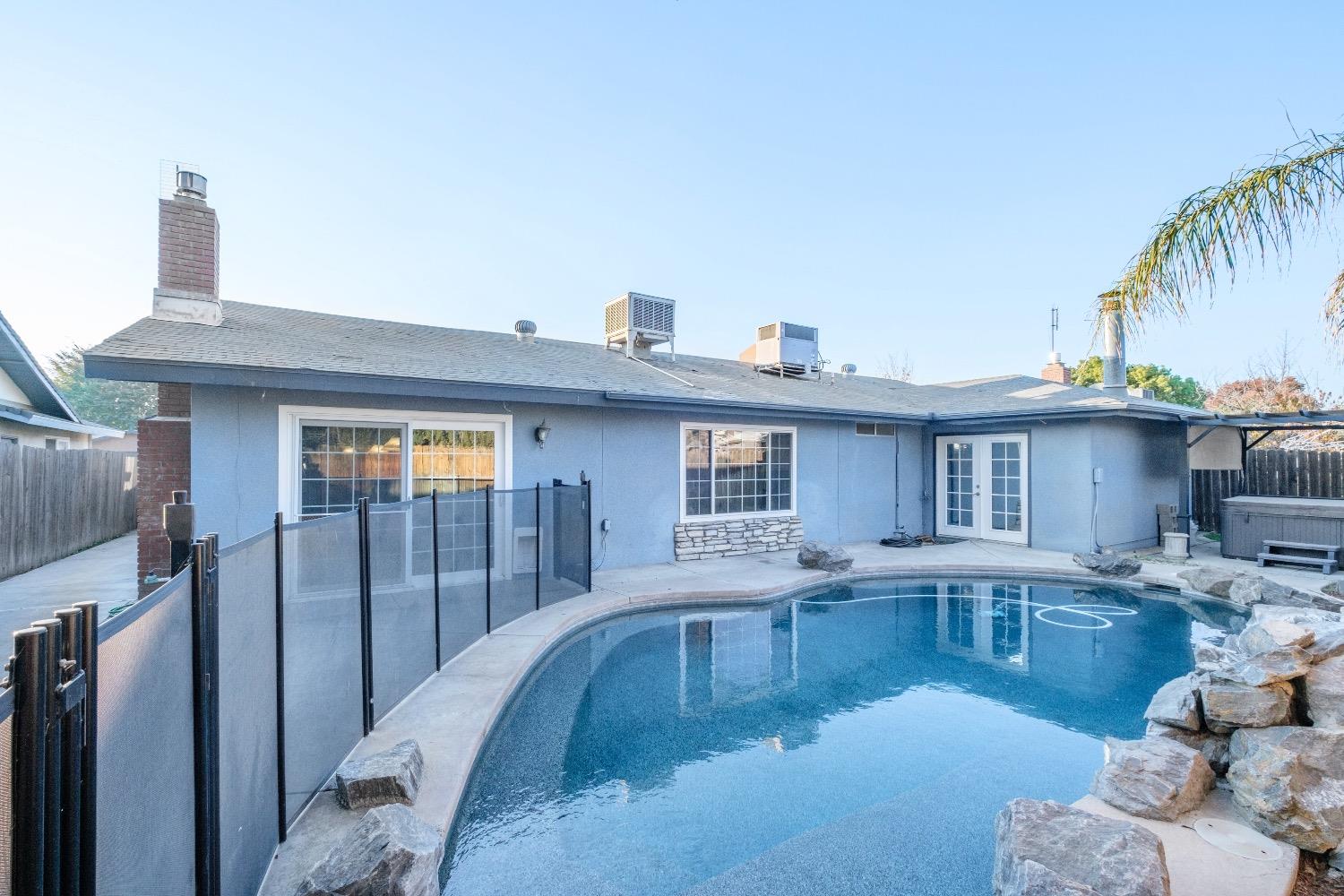 915 Fordham Avenue Clovis, CA 93611 - Photo 23 of 23 a view of a house with swimming pool