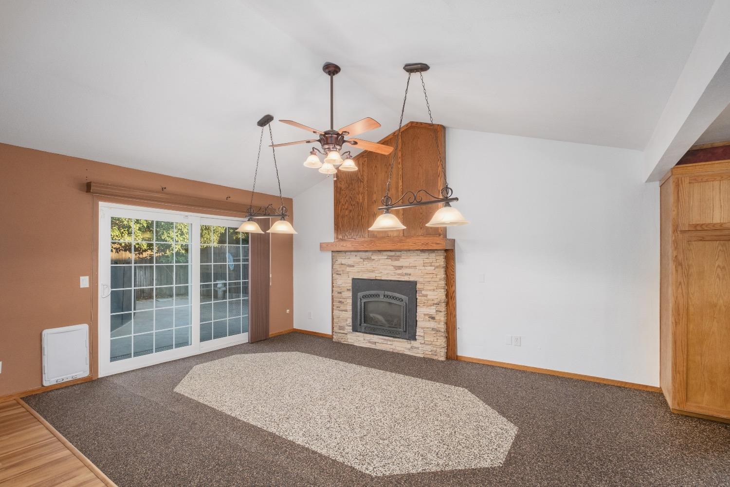 915 Fordham Avenue Clovis, CA 93611 - Photo 7 of 23 a living room with furniture and a fireplace