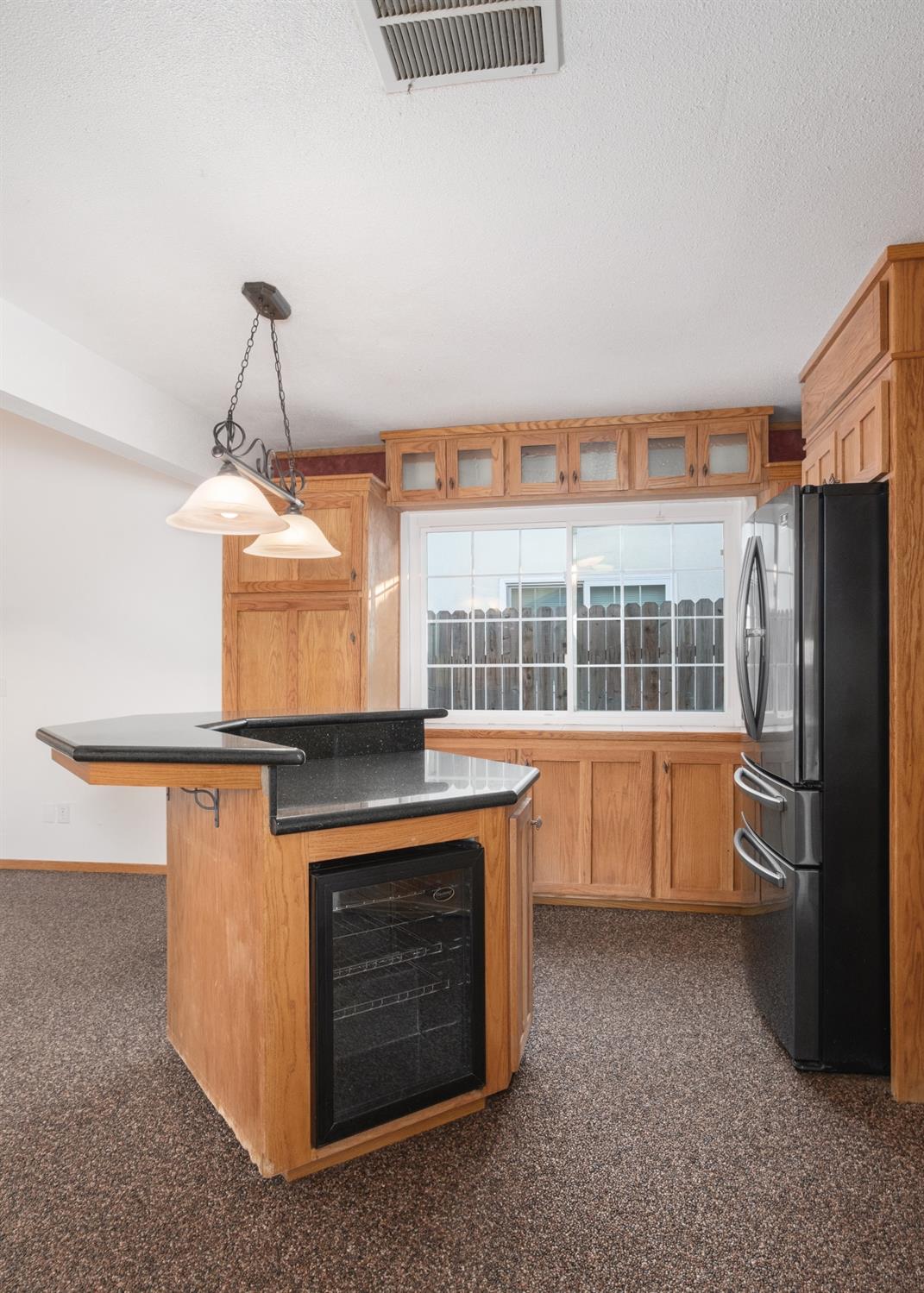 915 Fordham Avenue Clovis, CA 93611 - Photo 10 of 23 a kitchen with a stove and a refrigerator