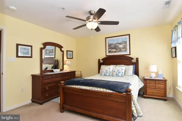 a bedroom with a bed and furniture