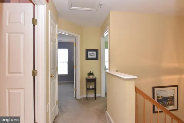 a view of a hallway view with staircase