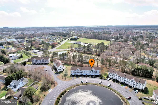 an aerial view of a house with a swimming pool