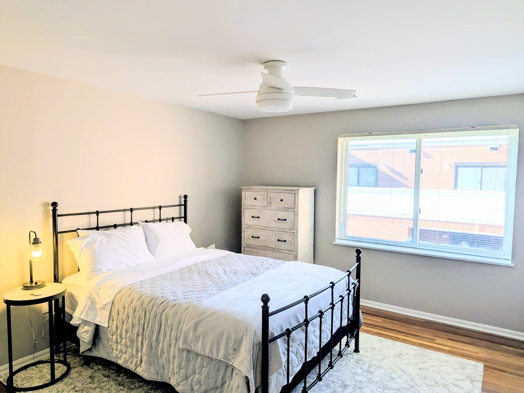 20 Central Street, Unit 405 Salem, MA 01970 - Photo 11 of 18 a bedroom with a bed and a window