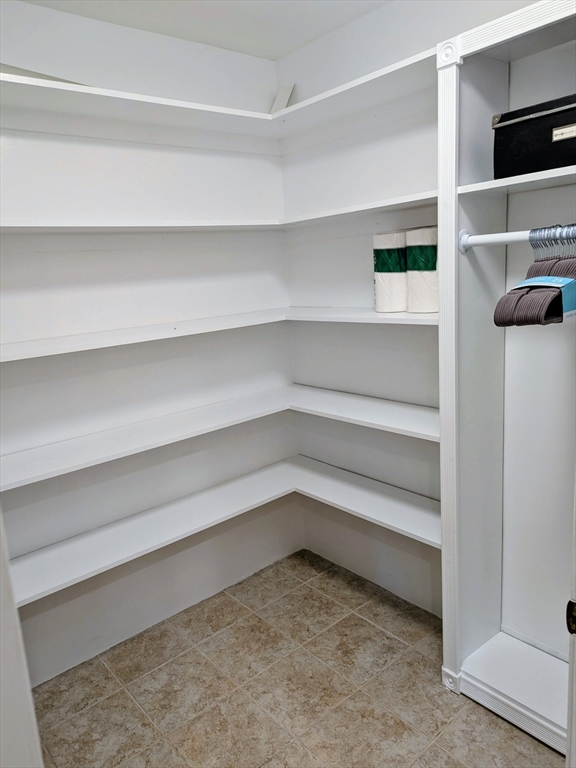 20 Central Street, Unit 405 Salem, MA 01970 - Photo 16 of 18 a view of walk in closet with empty racks