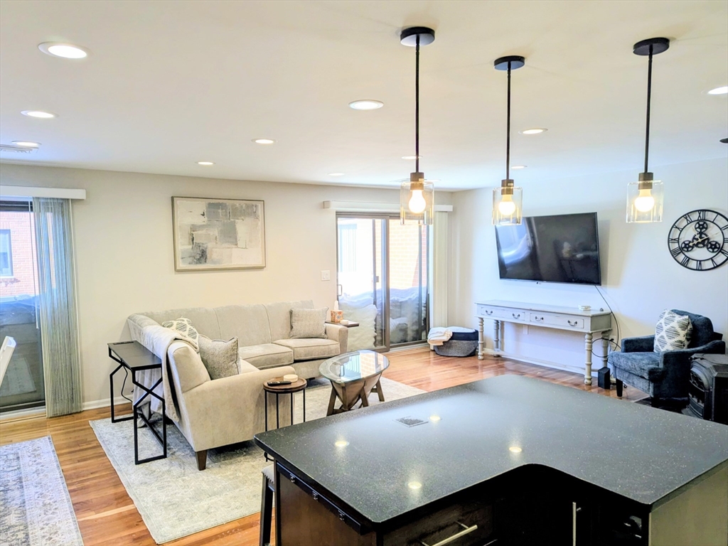 20 Central Street, Unit 405 Salem, MA 01970 - Photo 4 of 18 a living room with furniture and window