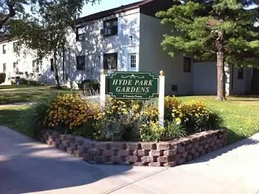 a sign that is sitting in front of a house