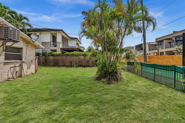 a view of a living room and dining room