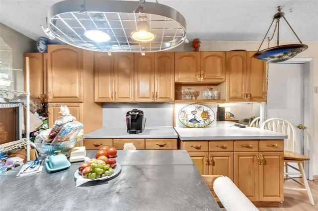 a bedroom with a bed and a flat tv screen on dresser