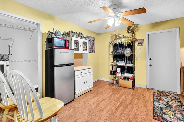 a patio with table and chairs
