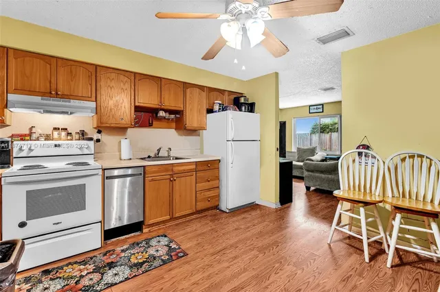 a bedroom with two beds and a flat screen tv