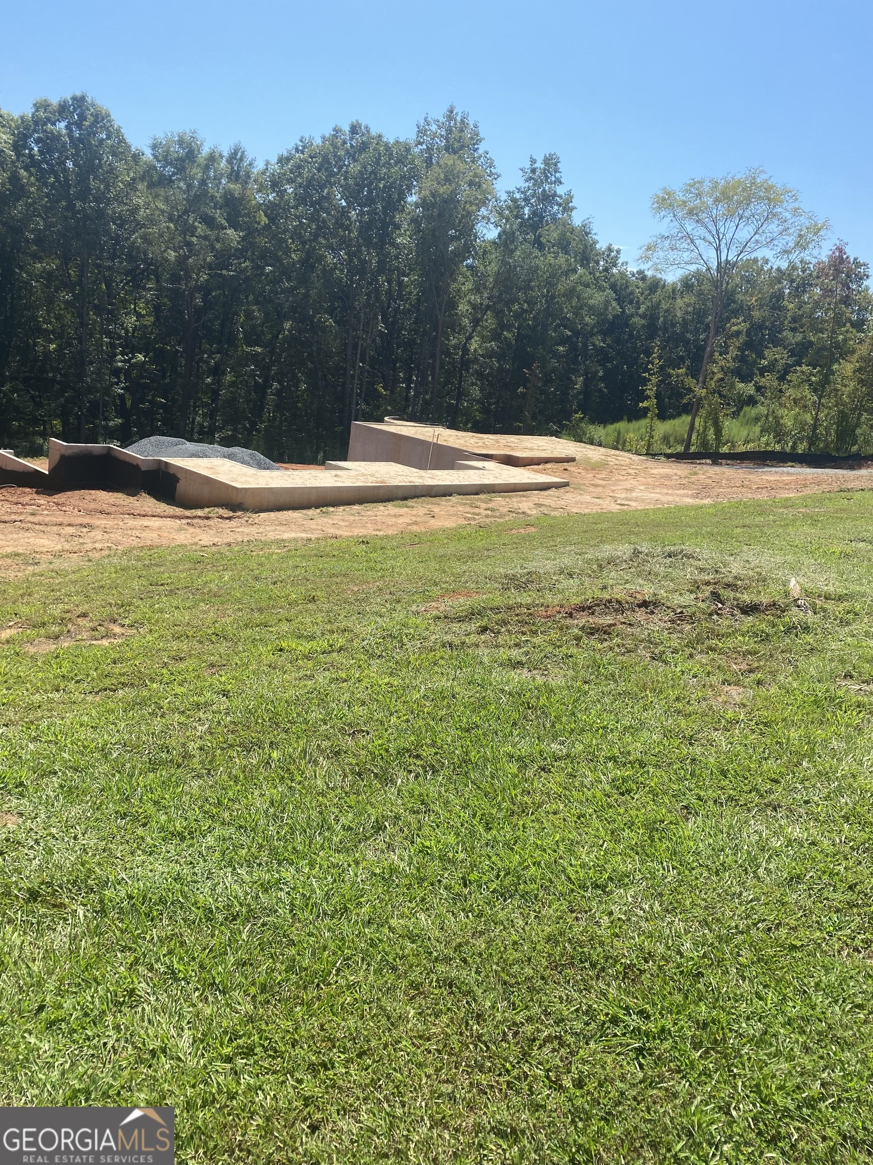 415 Forest Pointe Drive Forsyth, GA 31029 - Photo 7 of 12 a view of a field with trees in the background