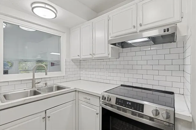 a view of a kitchen with cabinets