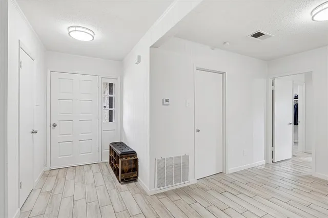 a view of a livingroom with wooden floor