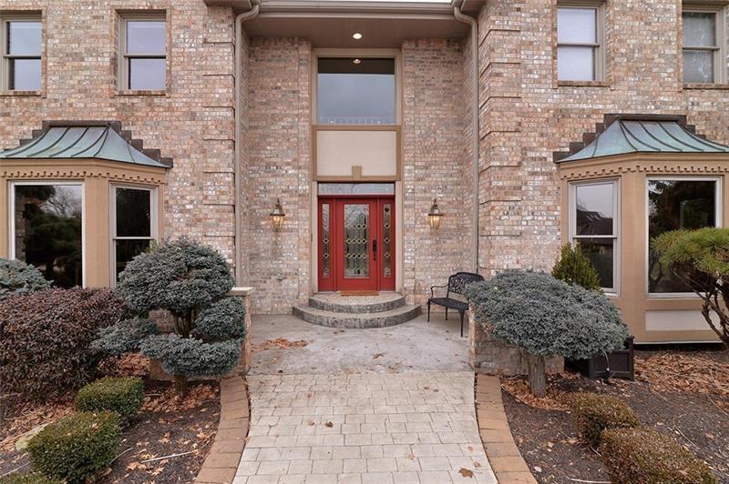 104 Gatehouse Drive Coraopolis, PA 15108 - Photo 2 of 24 a view of a brick house with large windows