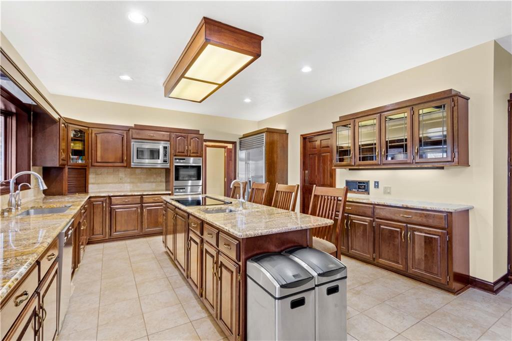 104 Gatehouse Drive Coraopolis, PA 15108 - Photo 11 of 24 a kitchen with stainless steel appliances granite countertop a stove and a sink