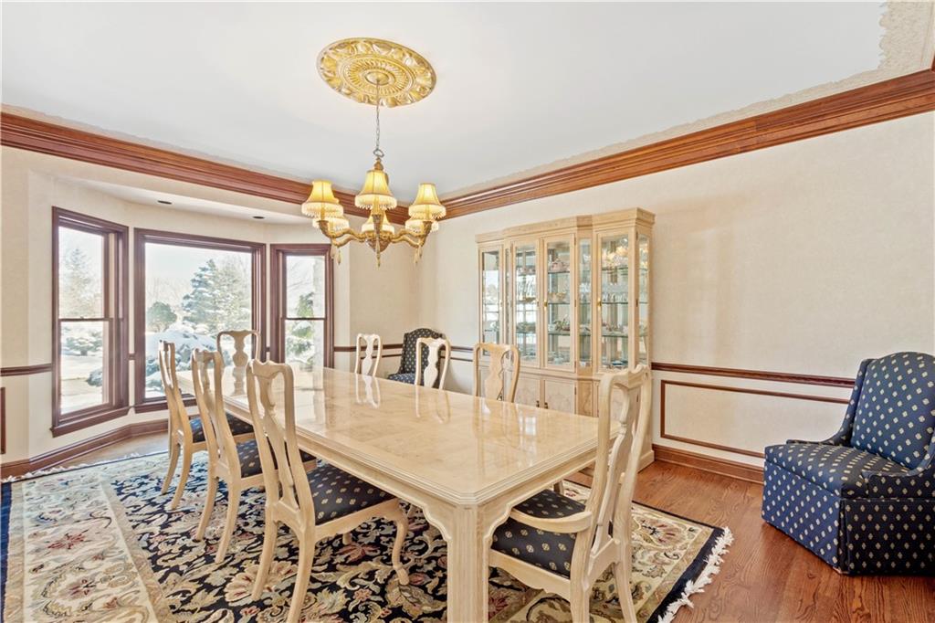 104 Gatehouse Drive Coraopolis, PA 15108 - Photo 14 of 24 a dining room with furniture a chandelier and wooden floor