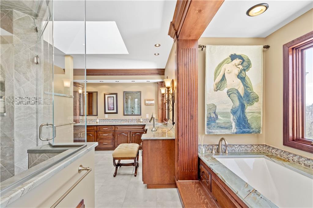 104 Gatehouse Drive Coraopolis, PA 15108 - Photo 18 of 24 a bathroom with a granite countertop tub sink and mirror