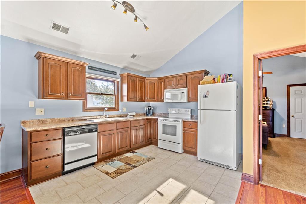 104 Gatehouse Drive Coraopolis, PA 15108 - Photo 20 of 24 a kitchen with a refrigerator and a stove top oven