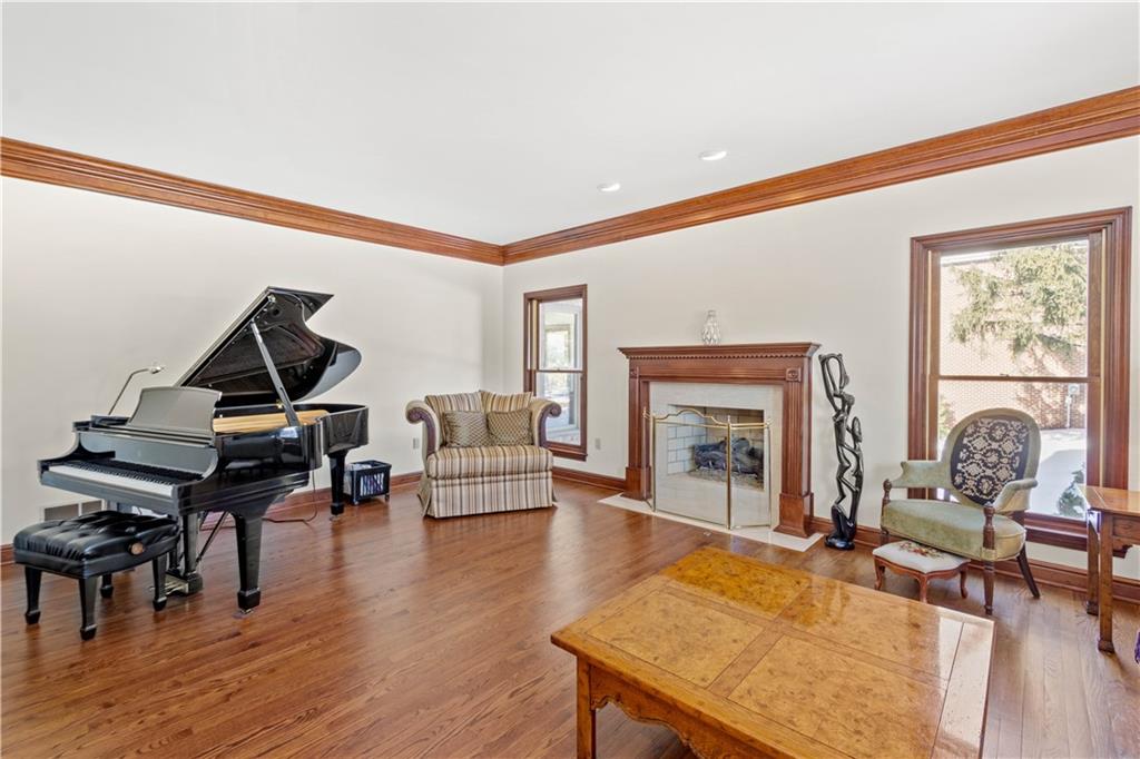 104 Gatehouse Drive Coraopolis, PA 15108 - Photo 4 of 24 a living room with furniture a piano and a fireplace