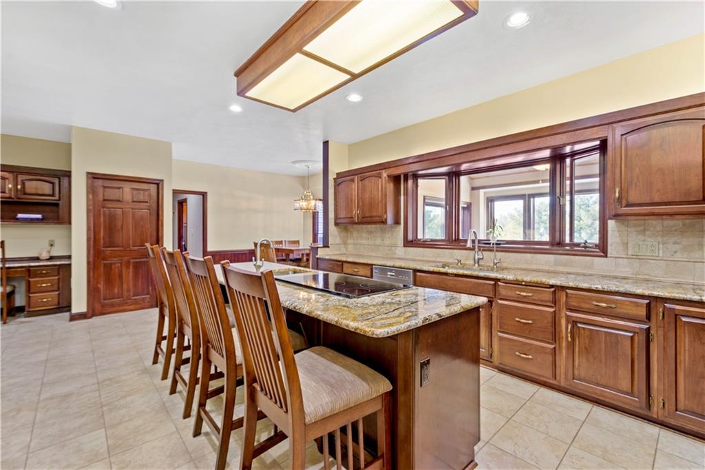 104 Gatehouse Drive Coraopolis, PA 15108 - Photo 10 of 24 a dinning table and chairs in a open kitchen