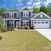a front view of a house with swimming pool
