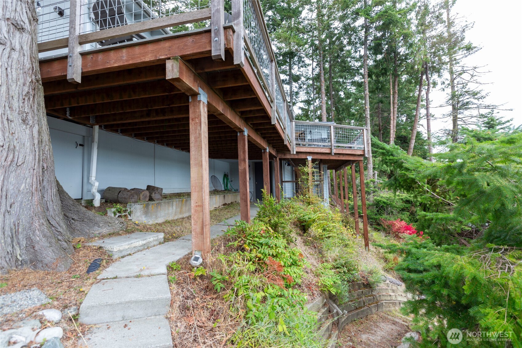 457 White Point Road Friday Harbor, WA 98250 - Photo 18 of 39 a backyard of a house with seating space