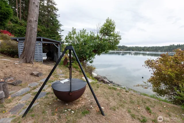a view of a lake in middle of the forest