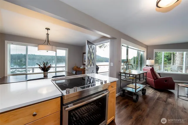 a living room with furniture and a dining table
