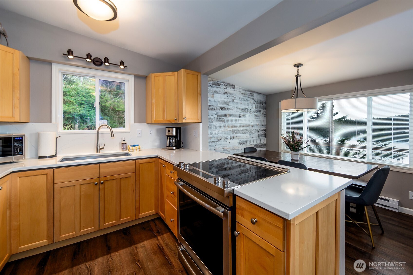 457 White Point Road Friday Harbor, WA 98250 - Photo 8 of 39 a kitchen with a stove a sink a counter space and a window