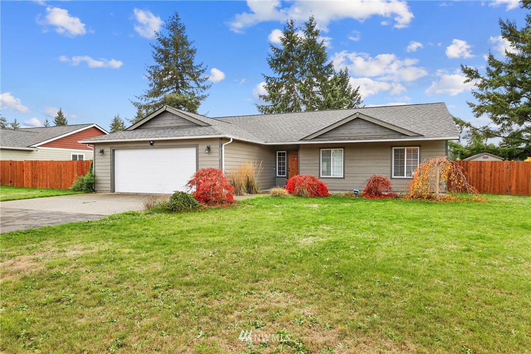 9327 179th Way Southwest Rochester, WA 98579 - Photo 1 of 20 a front view of a house with garden