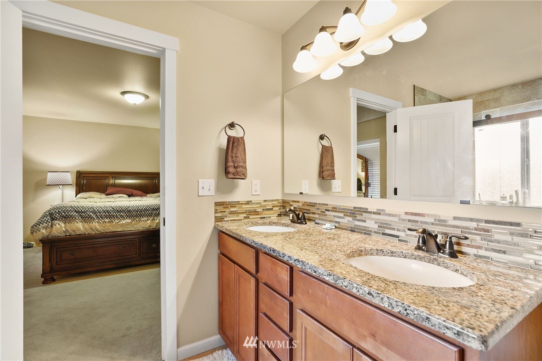 9327 179th Way Southwest Rochester, WA 98579 - Photo 11 of 20 a bathroom with a sink vanity and a mirror