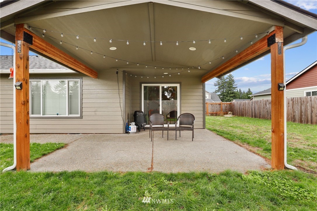 9327 179th Way Southwest Rochester, WA 98579 - Photo 18 of 20 a view of a house with backyard and sitting area