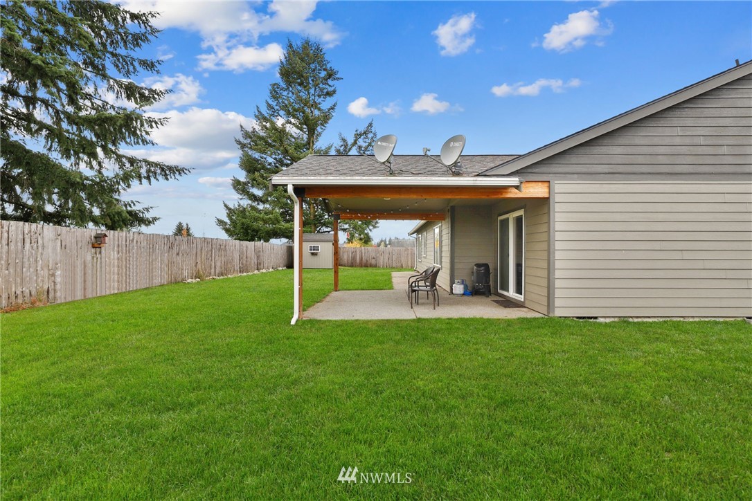 9327 179th Way Southwest Rochester, WA 98579 - Photo 19 of 20 a view of a house with backyard and porch