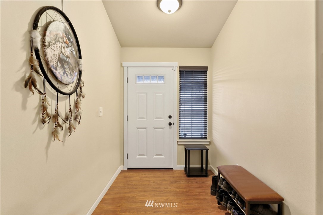 9327 179th Way Southwest Rochester, WA 98579 - Photo 3 of 20 an entryway with a table and a chair