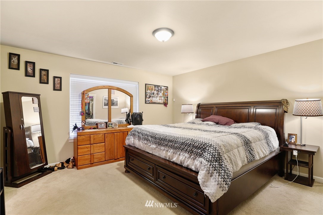 9327 179th Way Southwest Rochester, WA 98579 - Photo 9 of 20 a bedroom with bed and window