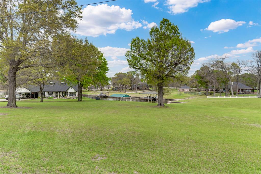 A2000 Azure Lane Streetman, TX 75859 - Photo 11 of 12 a view of outdoor space with garden and trees