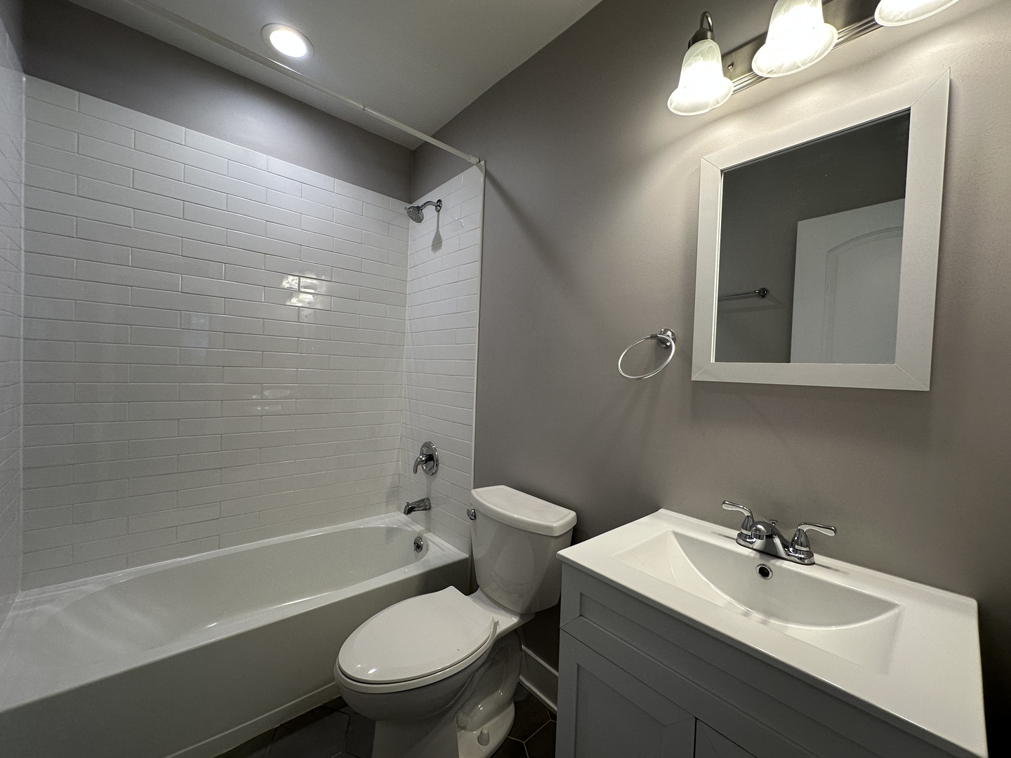 2053 West Iowa Street, Unit 1 Chicago, IL 60622 - Photo 11 of 12 a bathroom with a sink toilet and shower