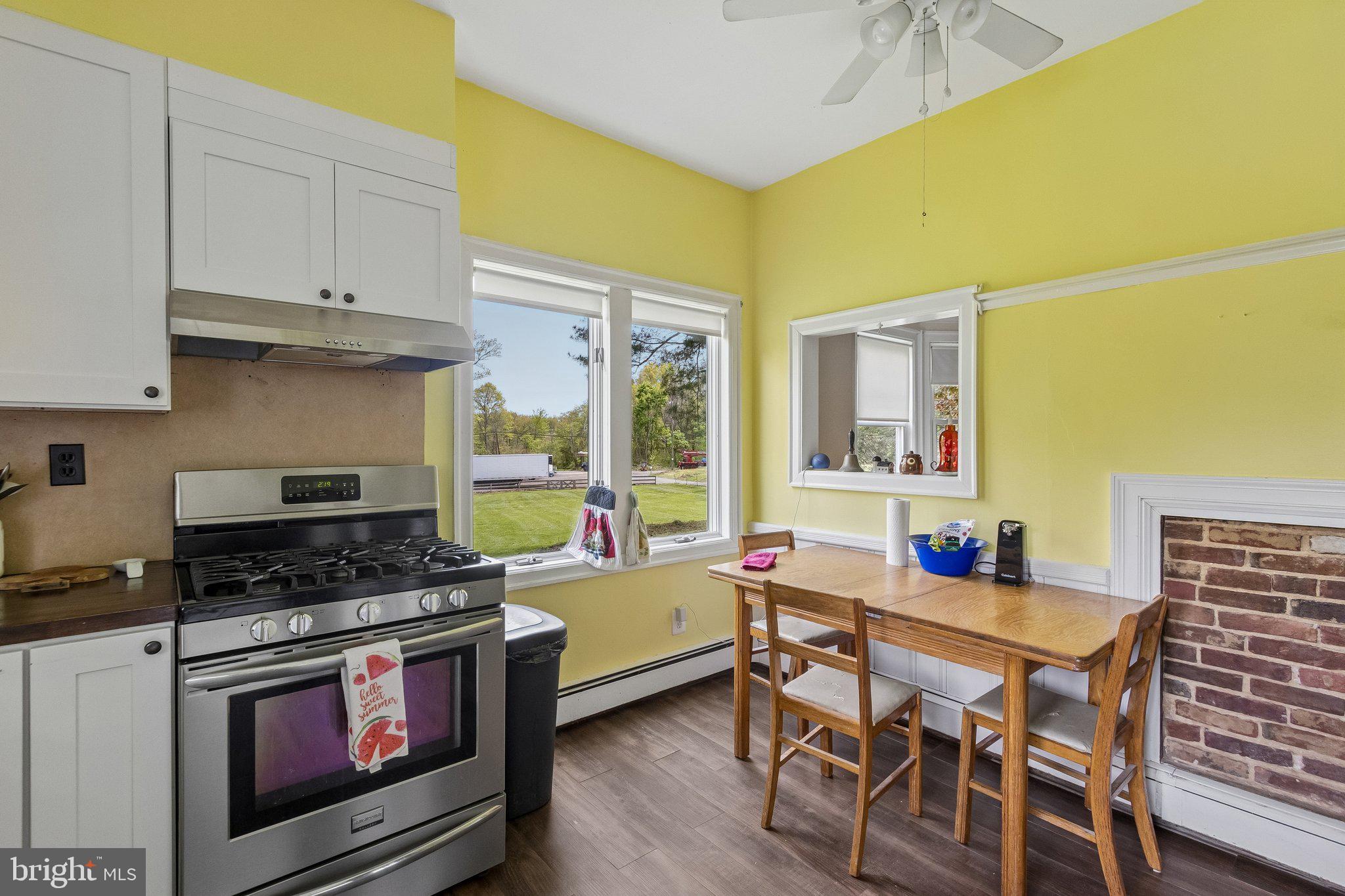 1272 Old York Road Hightstown, NJ 08520 - Photo 35 of 39 Sunny kitchen with vibrant yellow walls.