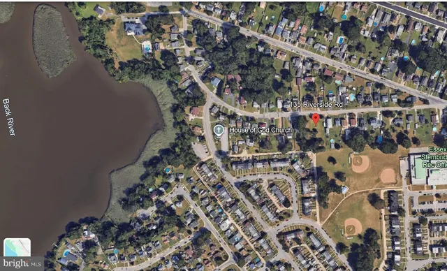 a view of a field with lots of trees